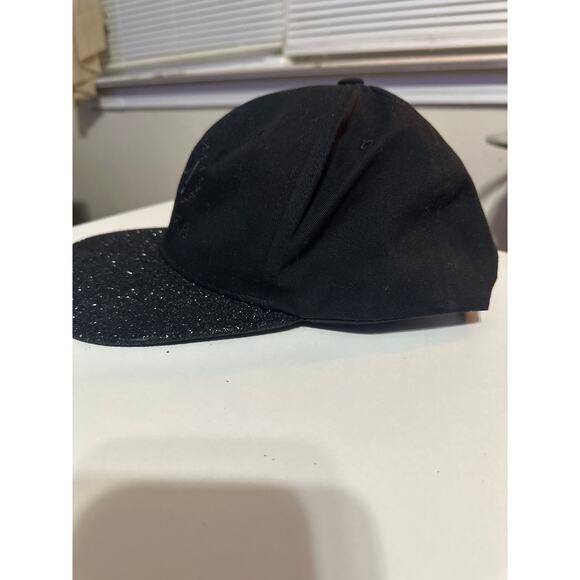 This is a Pit Bull Pukka black snapback hat with a glitter brim. Wore once - Picture 4 of 6
